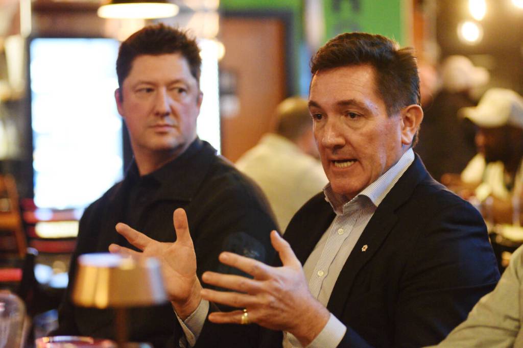 B.C. Conservative leadership candidate Yuri Fulmer, right, with Adam Hayduk, discusses a talking point during a meet and greet at Alberni Brewing on Friday, Jan. 9, 2026. (Susie Quinn/ Alberni Valley News)